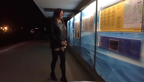 Girl in dress masturbates outside the train station