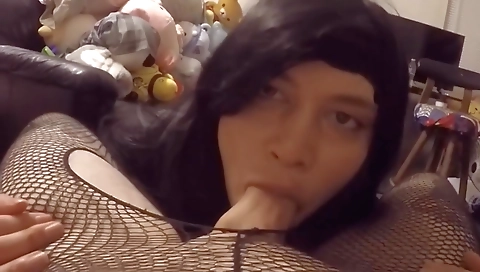 Brunette in stockings is shaking her pussy with a huge dick