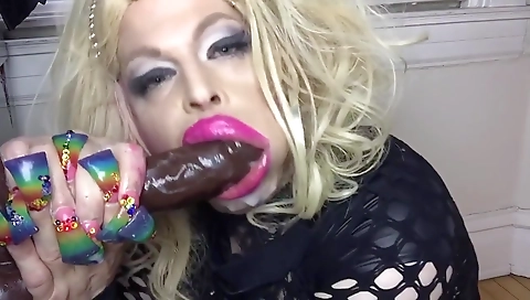 Blonde shemale sucks and fucks his dick on the bed