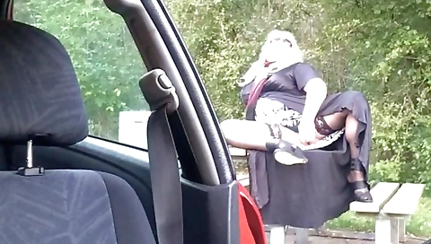 Her sexy stockings are on while riding a toy outdoors