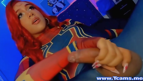 Sexy redhead with a sexy red dress enjoys a solo masturbation