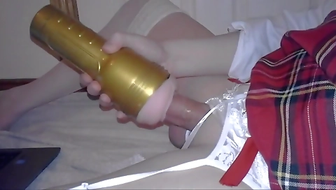 Crossdresser plays with fleshlight and strokes cock
