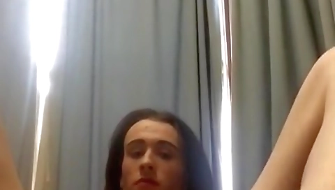 Amateur shemale with a dildo uses a dildo on her cock