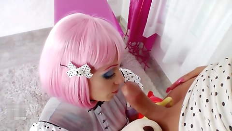 Blonde teen with a pink wig plays with a large dick