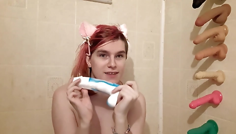 Sexy redhead solo shemale with small tits plays with a toy