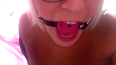 Tranny caged in chastity strapped in a tight gag awaits her Step daddy