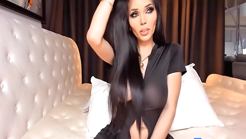 Bright and busty brunette trans shemale enjoys solo session