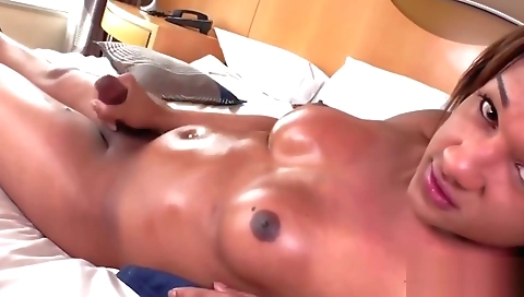 Latina chick masturbates with her big ass on her table